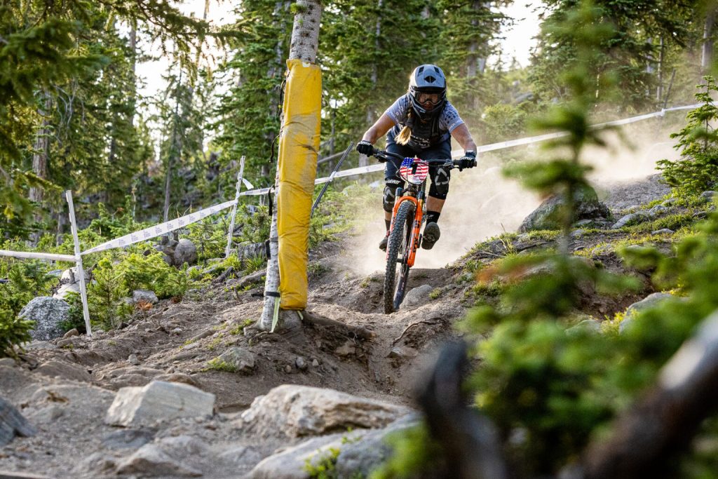 Amy Morrison Is Navigating Rugged Trail Features On Her Mountain Bike