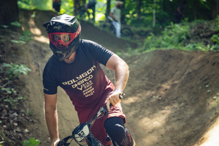 Cornering over the dirt with an enduro mountain bike