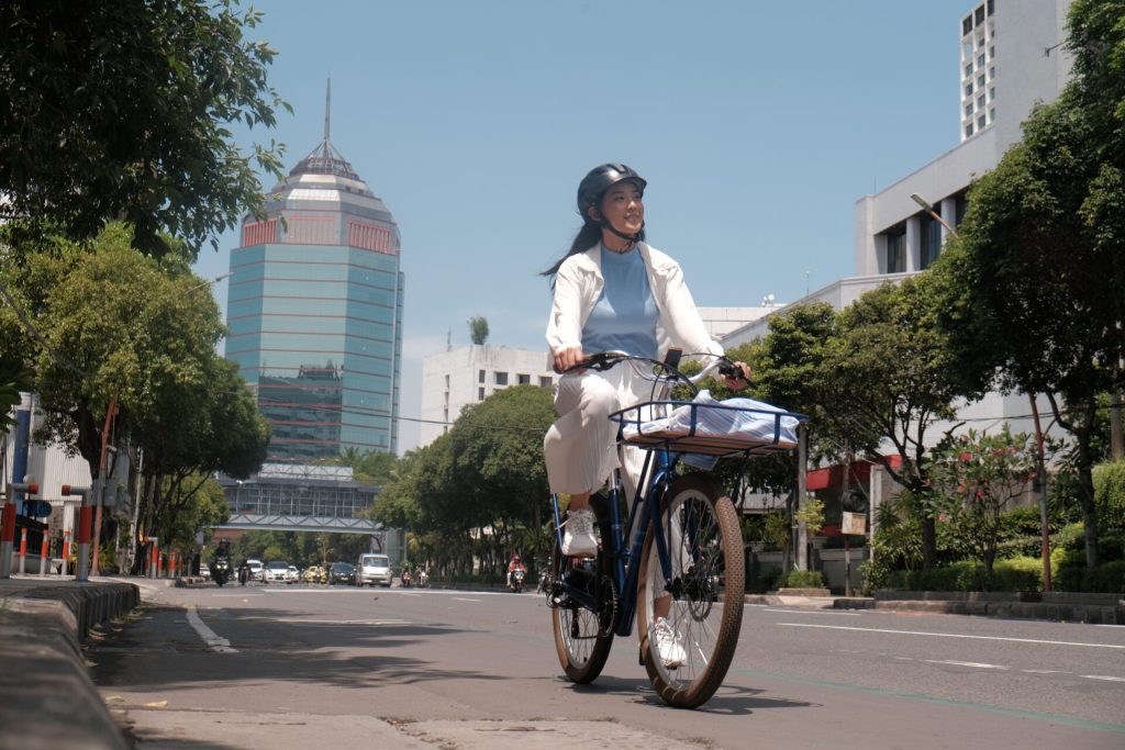 Cyclist Protected With Sunscreen While Riding In Hot Sun
