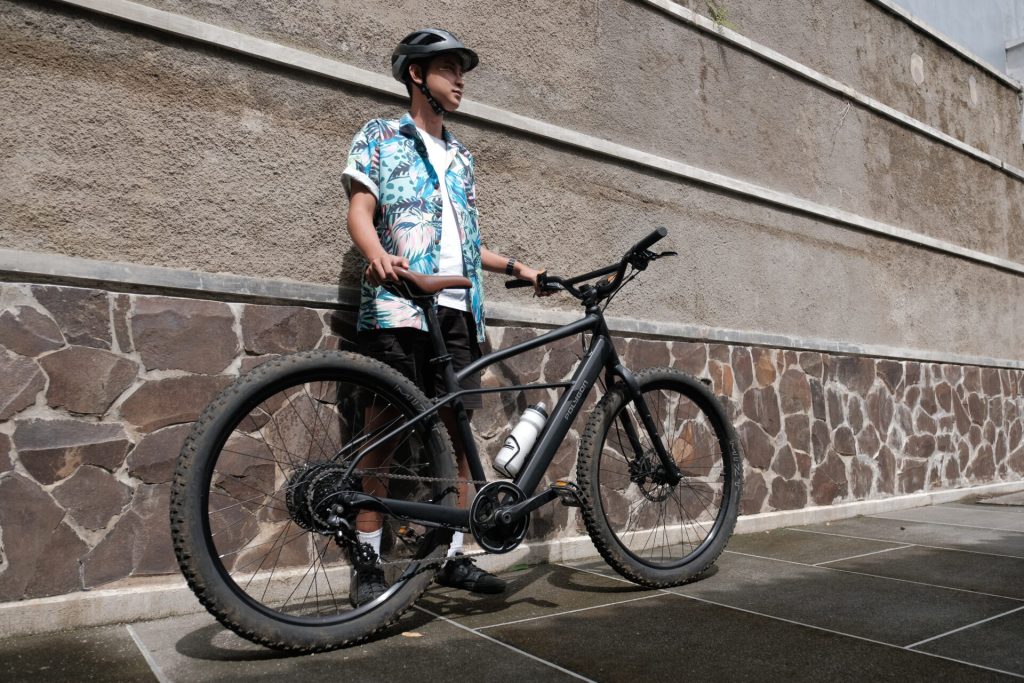 Rider Standing And Holding A Bmx Bike