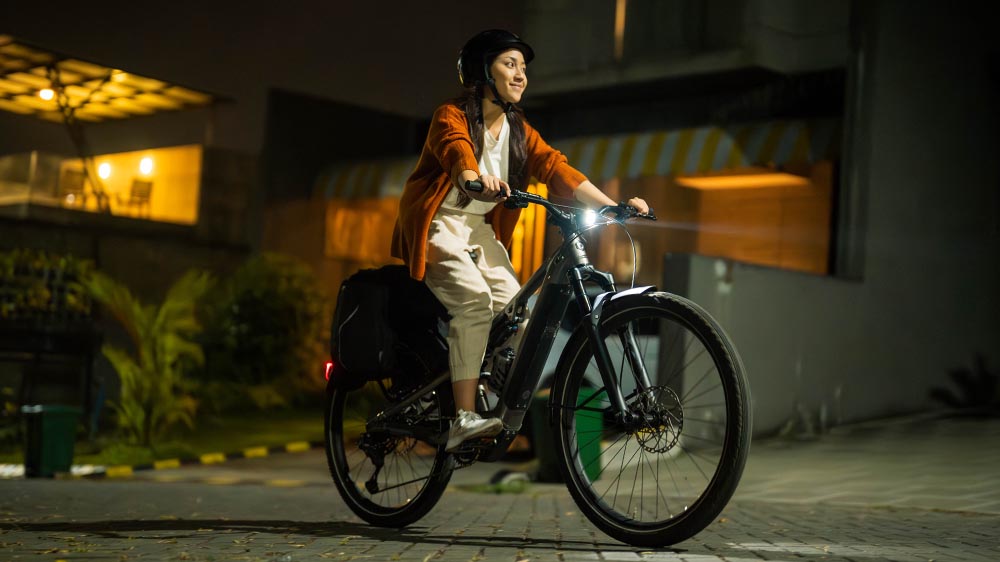 City commuting with full safety equipment using an electric bike