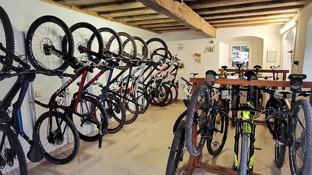 An electric mountain bike is properly stored in a bike garage