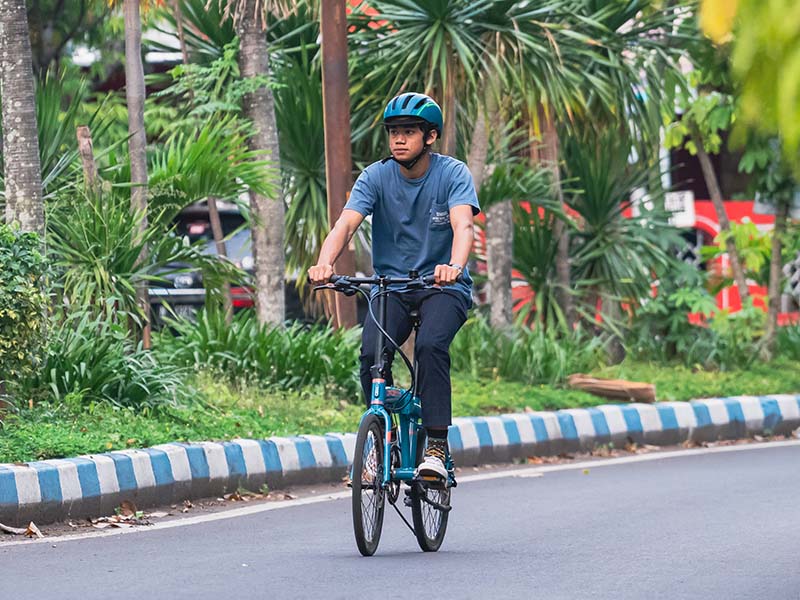 Riding A Folding Bike With A Smile