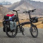 Cyclist Enjoying A Scenic Tour On A Foldable Bike