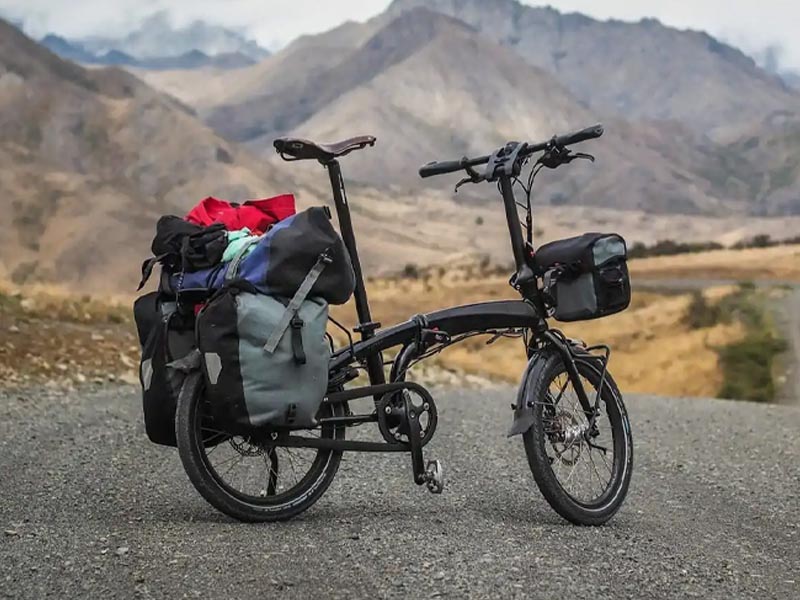 Cyclist Enjoying A Scenic Tour On A Foldable Bike