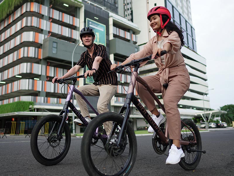 Friends Riding Bikes While Enjoying Cityscapes