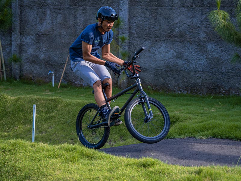 Practicing Bmx Tricks On A Bike Park