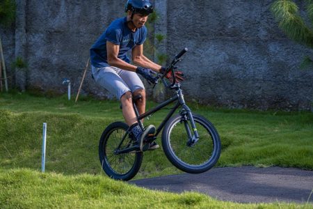Bmx Rider Performing Tricks At A Bike Park