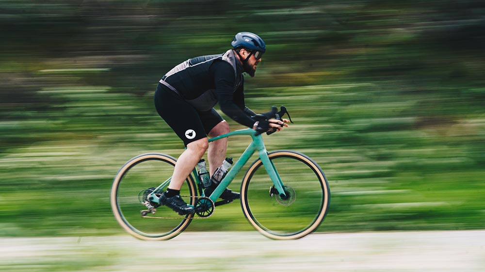 Cyclist using a gravel bike on asphalt