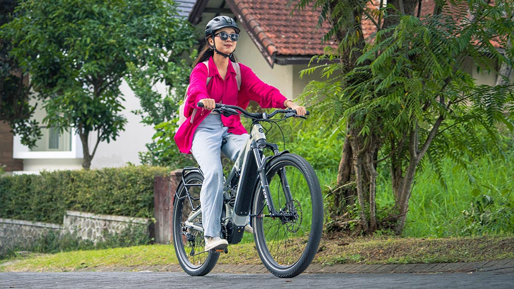 Leisure ride with an electric bike in a green park