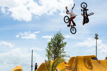Skilled Rider Executing Bmx Tricks With Lasting Energy