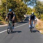 Cyclist Riding A Road Bike Through Busy Urban Streets