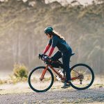 Cyclist On A Long Distance Bike Tour Through Scenic Countryside
