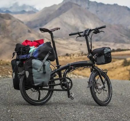 Cyclist Enjoying A Scenic Tour On A Foldable Bike