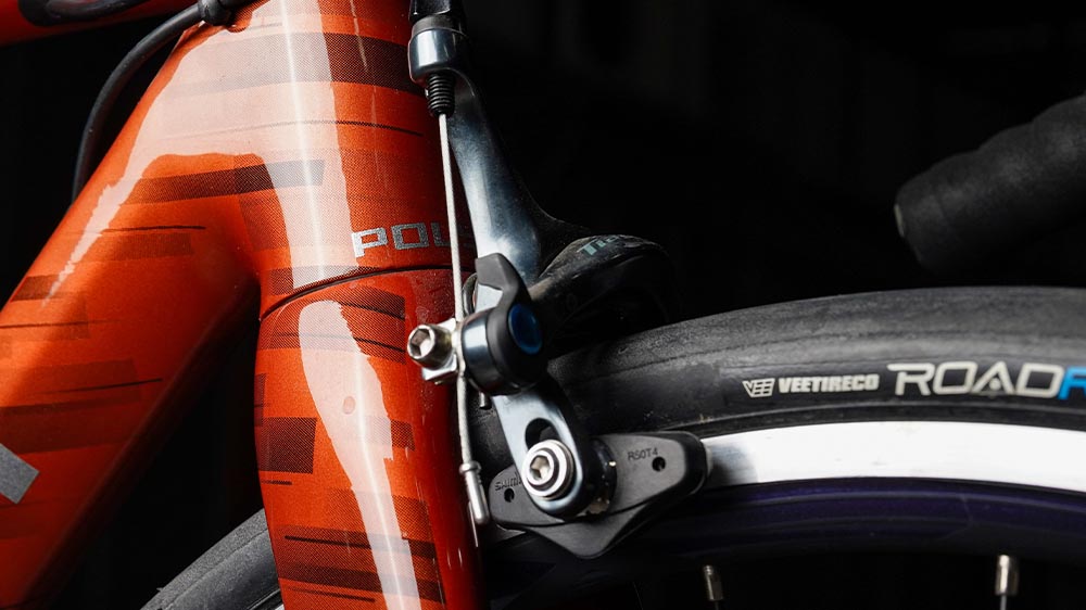 Close up of rim brakes on a classic road bike
