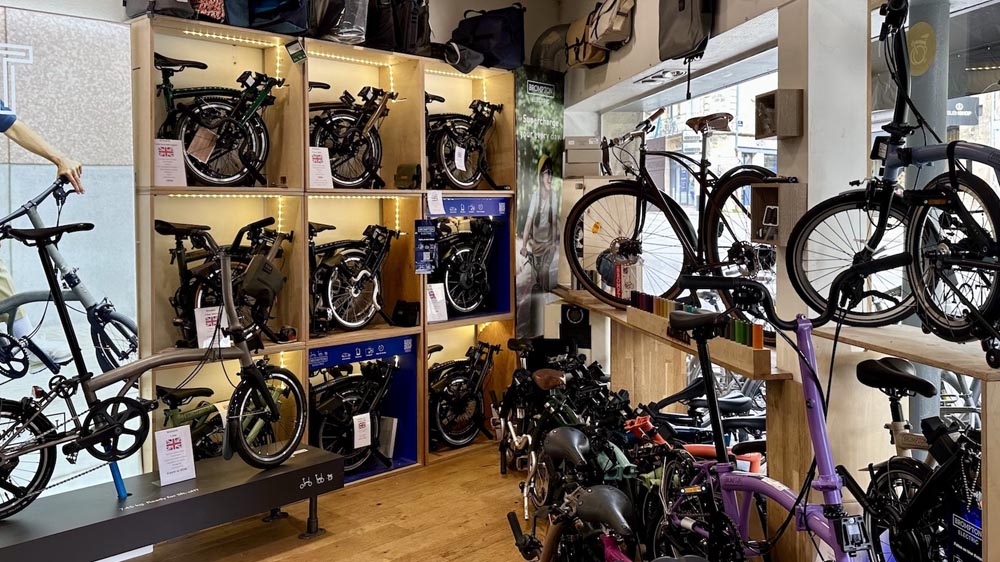 A cyclist selecting the perfect folding bike in store