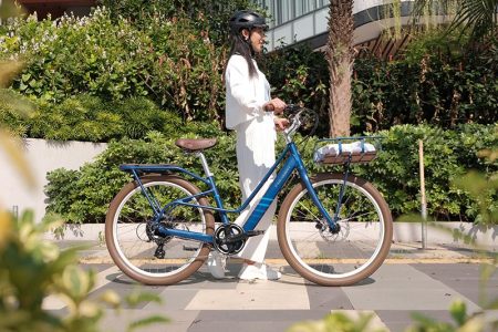 Female Cyclist Riding An Electric Bike