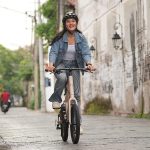 Leisure Cycling Through The City On A Mini Velo Bike