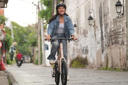 Leisure Cycling Through The City On A Mini Velo Bike