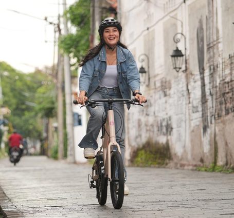 Leisure Cycling Through The City On A Mini Velo Bike