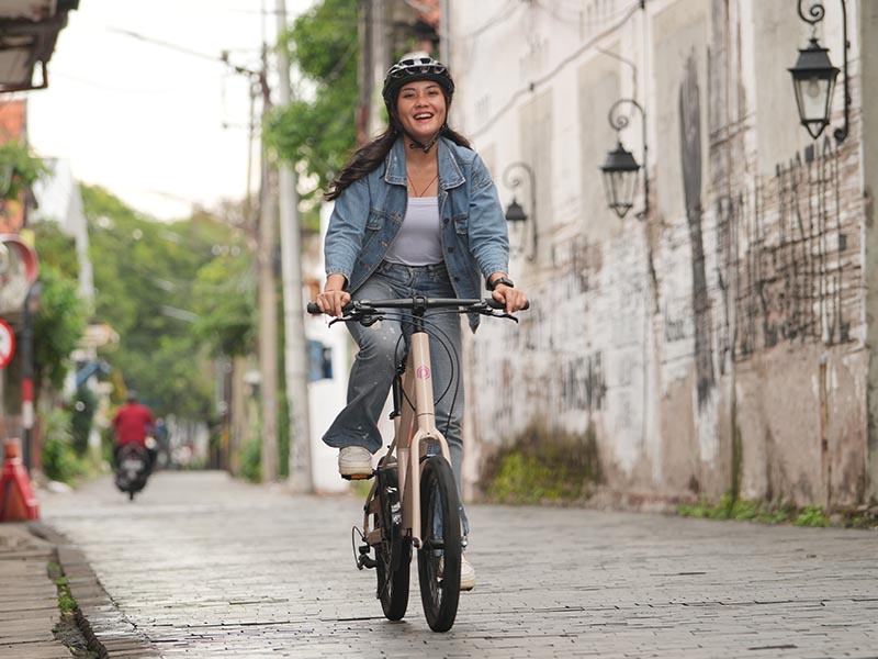 Leisure Cycling Through The City On A Mini Velo Bike
