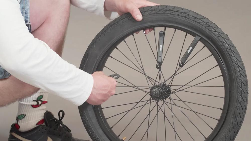 Installing new tires on a BMX bike