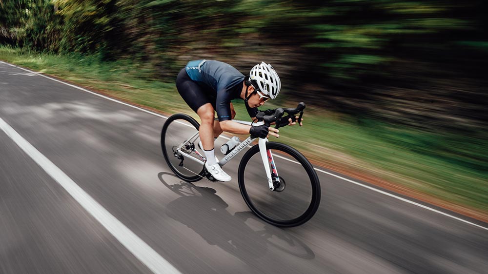 Road cyclist sprinting at high speed