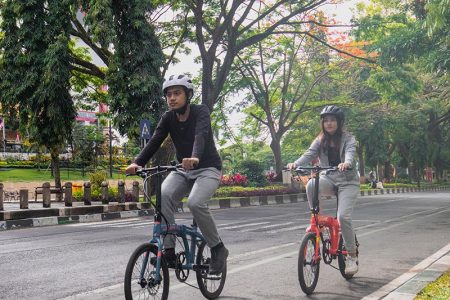 Riding A Foldable Bike On The Road