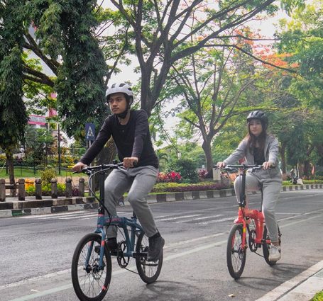 Riding A Foldable Bike On The Road