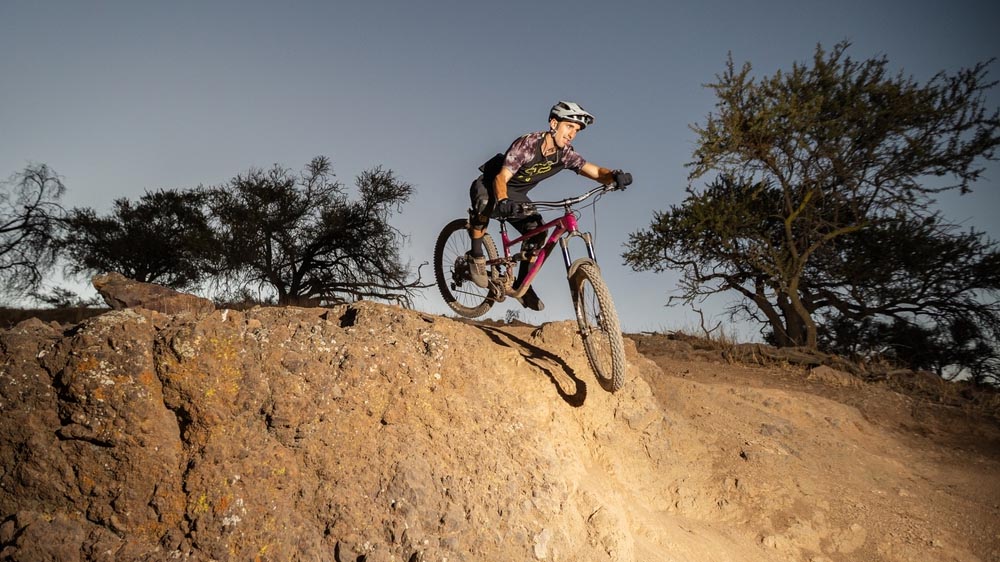 Full Suspension Mountain Bike Tackling Rugged, Technical Terrain With Control