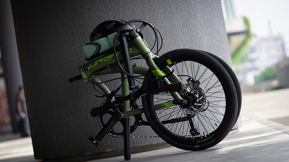 Compact storage of a folding bike beneath a table